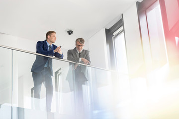 Low angle view of business colleagues discussing at office