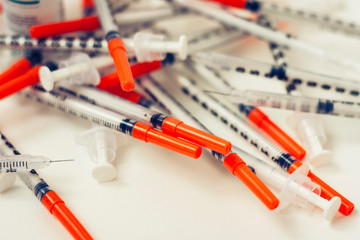 Pile of medical syringes for insulin for diabetes .