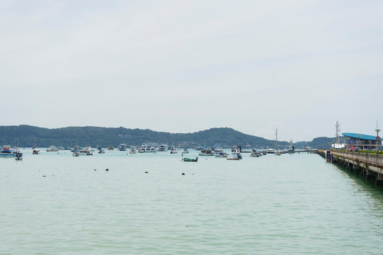 Fototapeta Many luxury yachts moored at Chalong Pier on sunny day in Phuket,Thailand