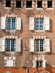 Fototapeta na wymiar Old facade with windows