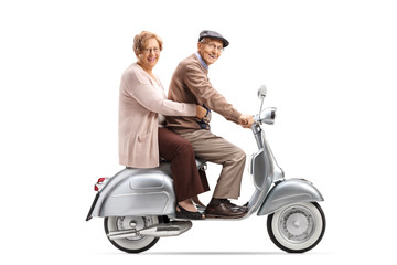 Senior man and woman on a vintage scooter