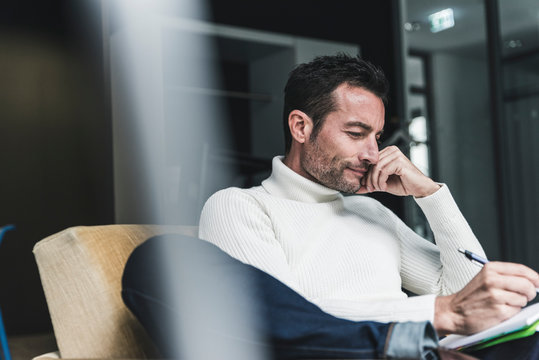 Businessman working relaxed in his office