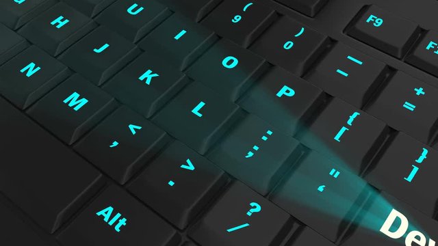 pointing the camera on blue glowing Develop key on black computer keyboard