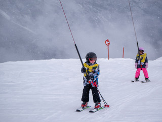 Zams, Austria - 22 Februar 2015: Children in ski school. Ski resort. Surface lift