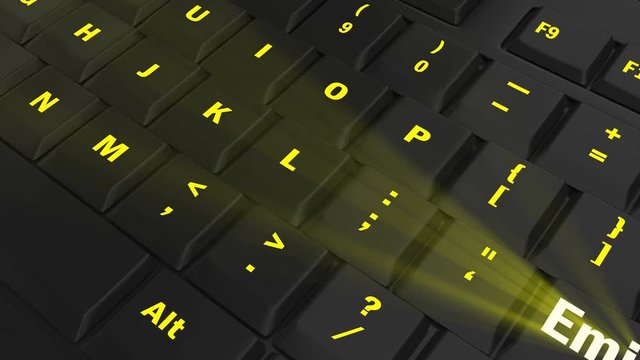 pointing the camera on yellow glowing Emigrate key on black computer keyboard