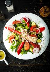 Delicious Greek salad of fresh vegetables on a plate