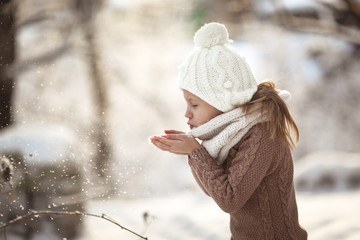 Funny Caucasian girl long hair blowing on snow