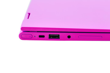 Part of the modern pink laptop with a power button, USB connector, headphone jack and volume buttons