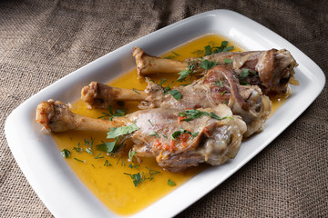Azerbaijani buglama, on a white plate with herbs and gravy