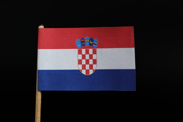 Naklejka premium A official and unique flag of Croatia on toothpick on black background. A horizontal tricolour of red, white, and blue with the Coat of Arms of Croatia in the centre
