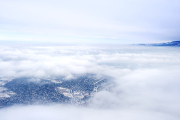 aerial view of clouds  over city from airplane