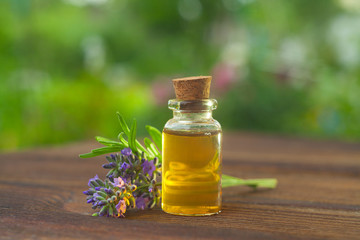 lavender essential oil in  beautiful bottle on table