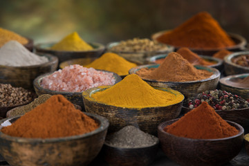 Aromatic spices on wooden background