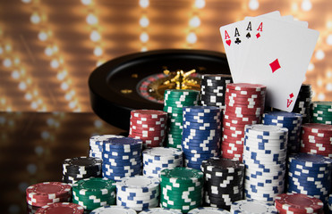 Poker Chips, Roulette wheel in motion, casino background