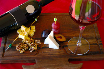 wine, glass and cheese plate