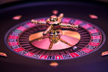 Gaming table, roulette wheel in motion