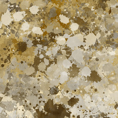 Isolated artistic gold watercolor and ink paint splatter textures and decorative elements on white paper background.