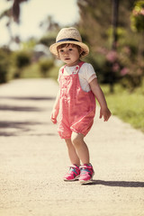 Fototapeta premium little girl runing in the summer Park