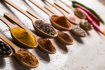 Variety of spices and herbs on kitchen table