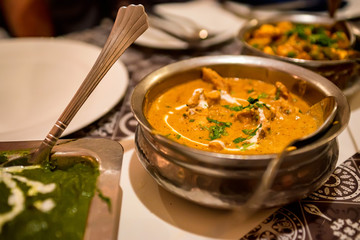 Delicious Mulligatawny soup in metal bowl, traditional Indian cuisine