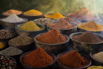 Smoke, Aromatic spices on wooden background