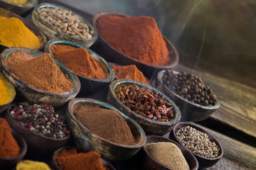 Smoke, Aromatic spices on wooden background