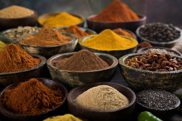 Aromatic spices on wooden background