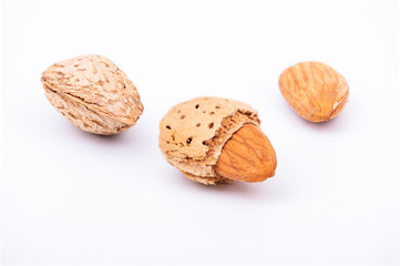 Almonds macro set, almond in nutshell and half almond on isolated white