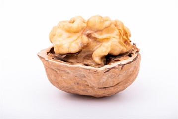 Cracked half walnuts isolated on white background with clipping path