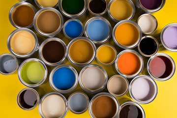 Brush, metal cans with color paint