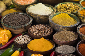 Hot spices in wooden bowls