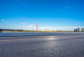 road with city skyline