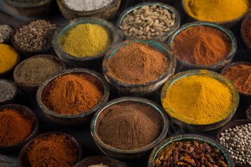 Aromatic spices on wooden background
