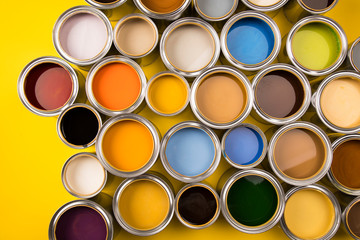 Brush, metal cans with color paint