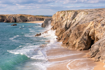 Fototapeta na wymiar French landscape - Bretagne. A beautiful beach with wild cliffs in the background.