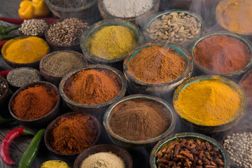 Smoke, Aromatic spices on wooden background