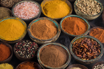Aromatic spices on wooden background