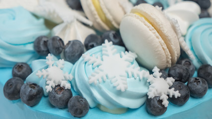 Delicious cake made from sugar paste. Zephyr and blueberry on the top of cupcake.