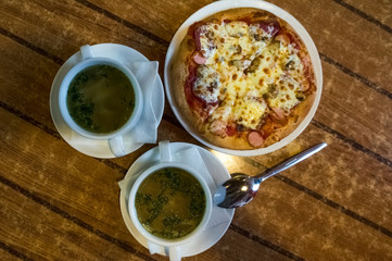 Tasty pizza and soup
