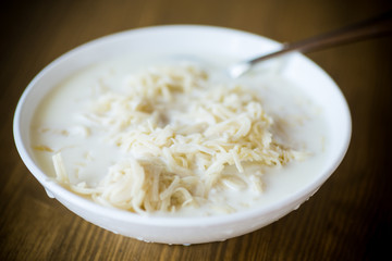 homemade sweet noodles with milk in a plate
