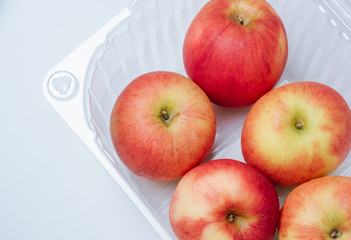 Apple in plastic container