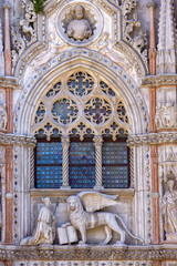 Winged lion and the doge Francesco Foscari above the Paper Gate of the Doge Palace in Venice, Italy.