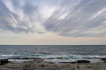 Beautiful panorama of rocky coast of Atlantic Ocean and cloudy sky