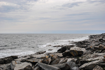 Beautiful view of rocky coast of Atlantic Ocean and cloudy sky