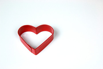 Red Metal Heart Shaped cookie Cutter isolated on White background