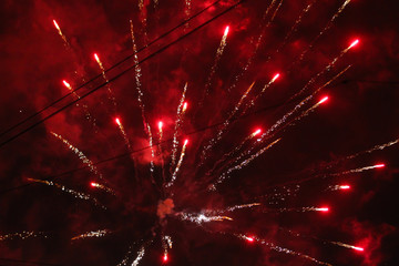 Fototapeta na wymiar Beautiful red fireworks blowing in the sky.