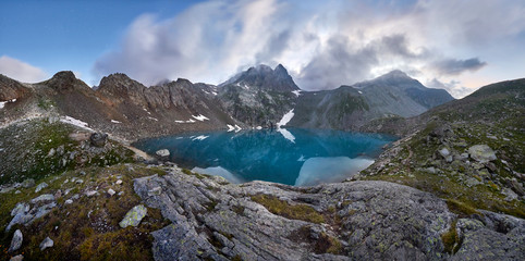 Fototapeta na wymiar Panoramic photos spring valley Caucasus mountains Arkhyz, Russia. Fabulous sunrise and sunset in the mountains of Sofia lakes, amazing nature, spring in the mountains. Travelling and Hiking