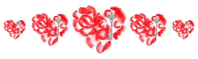 symmetrical pattern of red hearts laid out with feathers and keys on a white background. flat lay, top view, concept holiday
