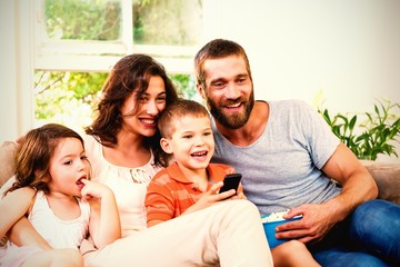 Obraz premium Family having fun while watching television