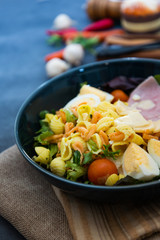 Fresh fruits salad and ham with egg